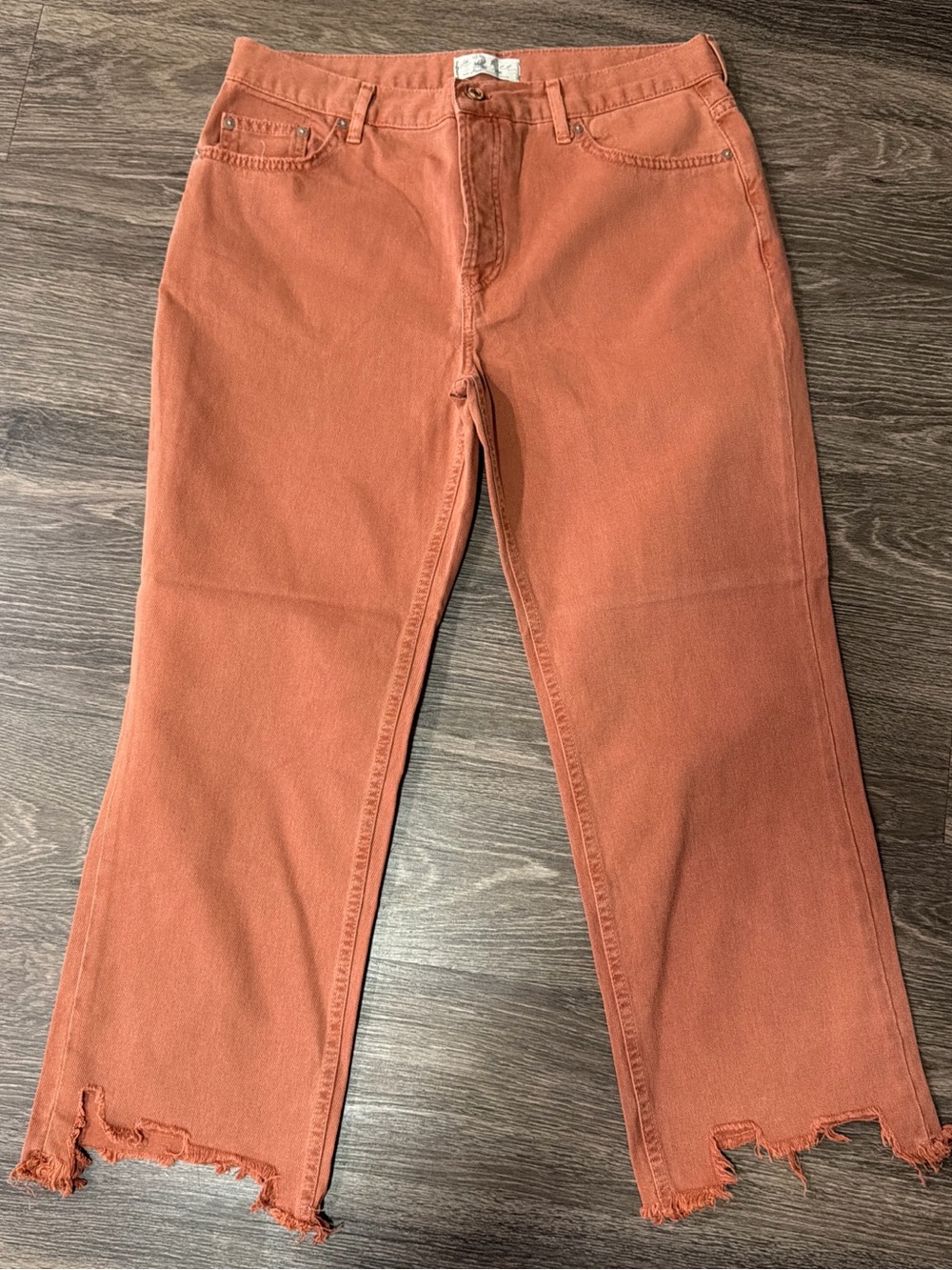 We The Free Flared Jeans in Burnt Orange with Frayed Hem size 31